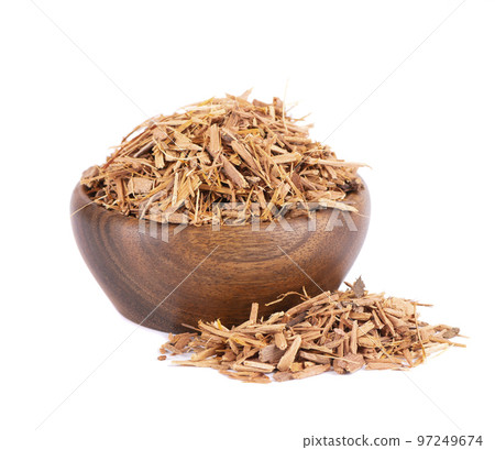 Catuaba bark in wooden bowl, isolated on white background. Trichilia catigua bark. Chuchuhuasha, Tatuaba, Pau de Reposta, Piratancara and Caramuru. 97249674