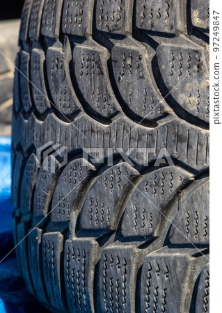 Close-up view of old black weathered tyre background 97249847