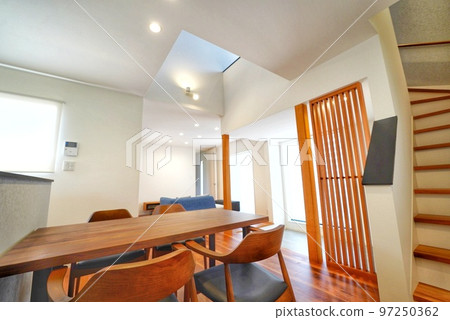 A living and dining room in a new house with a sense of openness A living and dining room in a new house with a sense of openness 97250362