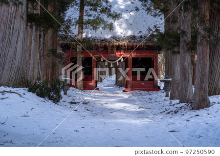 Zuijinmon Gate, the approach to Togakushi Shrine covered in snow Zuijinmon Gate, the approach to Togakushi Shrine covered in snow 97250590