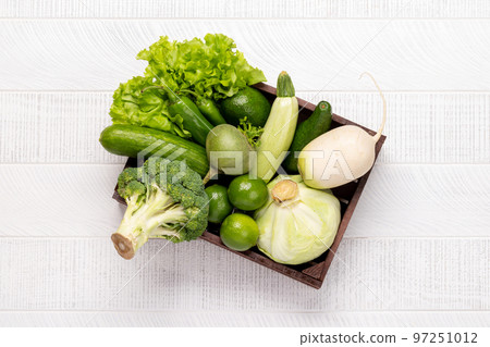 Wooden box bag full of healthy green food 97251012