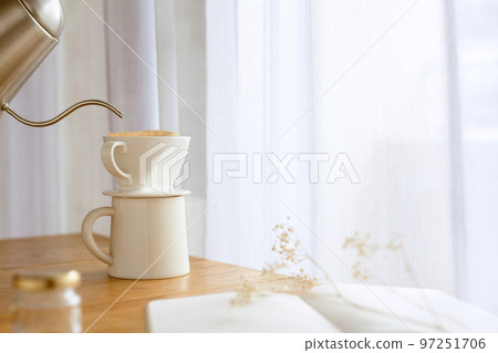 Pour hot water in the kettle during break time and make coffee Pour hot water in the kettle during break time and make coffee 97251706