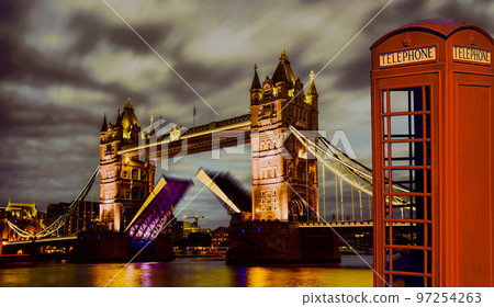 Famous Tower Bridge against red phone booth in London, England, UK 97254263