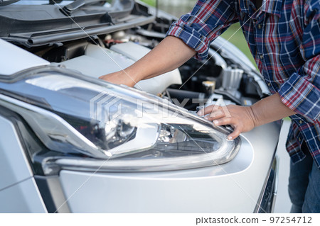 Open hood mechanic engine system to check and repair damage car crash. 97254712