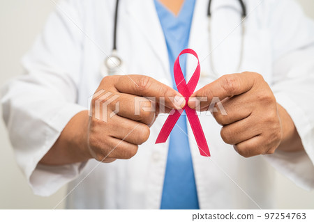 Breast cancer, Asian doctor woman with pink ribbon, symbol of World Breast Cancer Day. Breast cancer, Asian doctor woman with pink ribbon, symbol of World Breast Cancer Day. 97254763