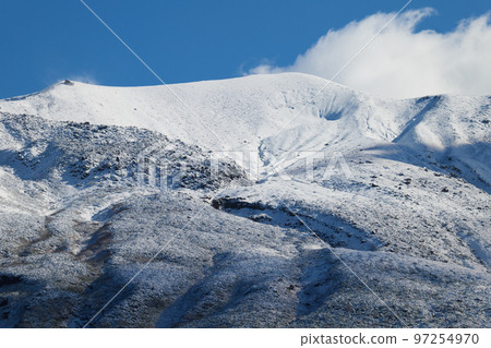 Tokachi mountain range covered with snow in autumn Tokachi mountain range covered with snow in autumn 97254970