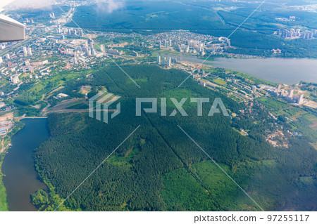 View from the airplane window during taking off on a clear summer morning. Yekaterinburg, Russia 97255117