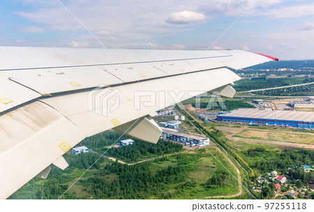View from the airplane window during taking off on a clear summer morning. Yekaterinburg, Russia View from the airplane window during taking off on a clear summer morning. Yekaterinburg, Russia 97255118
