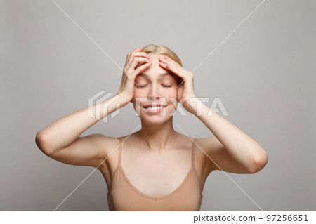 Beautiful young emotional spa model woman with fresh skin on white background. 97256651
