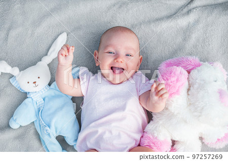 Baby girl 3 months laughs with toys. Newborn care 97257269