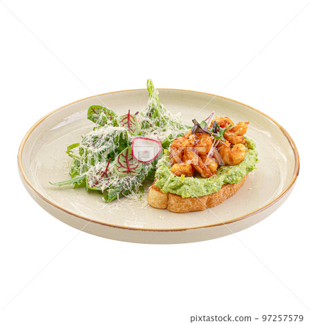 Portion of avocado toast with shrimp and salad 97257579