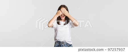 Cheerful smiling woman shut eyes and expect surprise Cheerful smiling woman shut eyes and expect surprise 97257937