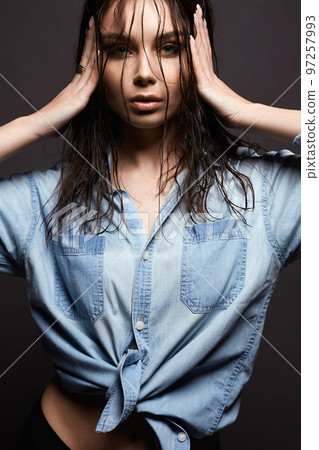 Sexual pretty wet woman in denim shirt. Beautiful Girl with wet hair 97257993