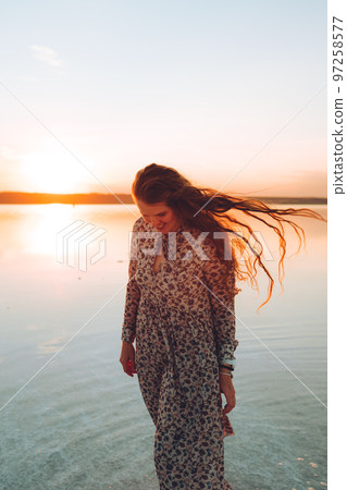 Portrait happy laughing woman in pink dress Portrait happy laughing woman in pink dress 97258577