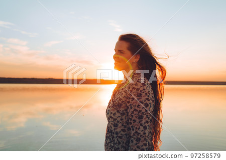 Portrait happy laughing woman in pink dress 97258579