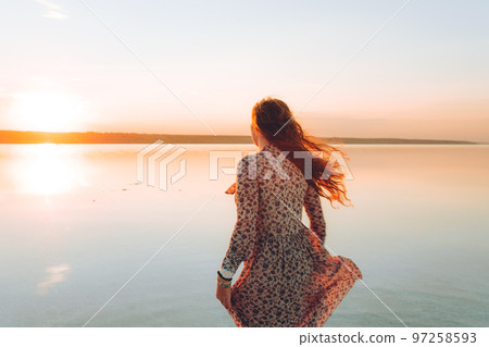 Portrait happy laughing woman in pink dress Portrait happy laughing woman in pink dress 97258593