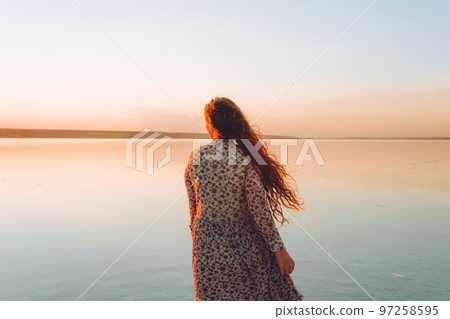 Portrait happy laughing woman in pink dress Portrait happy laughing woman in pink dress 97258595