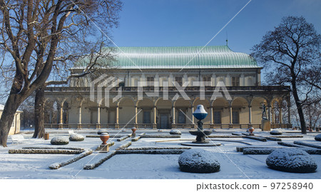 Royal garden in Prague Hradcany covered with snow. The building of Queen Anne's Summer Palace against a backdrop of clear blue sky and bathed in brilliant sunshine. Royal garden in Prague Hradcany covered with snow. The building of Queen Anne's Summer Palace against a backdrop of clear blue sky and bathed in brilliant sunshine. 97258940