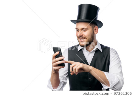 Man in cylinder hat with smartphone Man in cylinder hat with smartphone 97261306