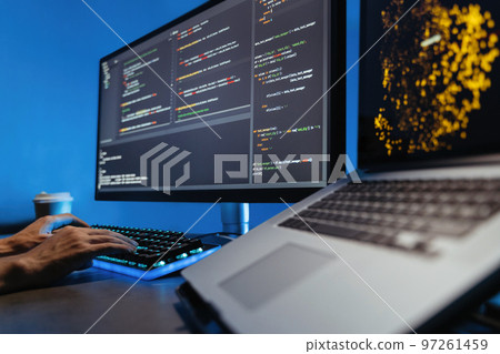 No face image of male hands typing on keyboard, writing html code for website on pc No face image of male hands typing on keyboard, writing html code for website on pc 97261459