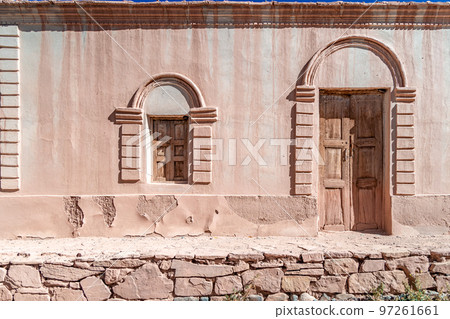 a house made of clay and red bricks in the countryside of Aregenina in the Andes mountains a house made of clay and red bricks in the countryside of Aregenina in the Andes mountains 97261661
