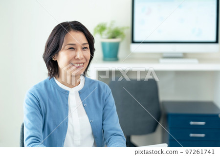 Middle woman working in the office 97261741