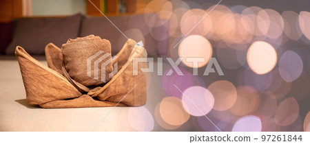Yellow towel on bed decoration in bedroom interior, Freshly laundered fluffy towels, Towel in hotel room, Beautifully folded toiletries 97261844