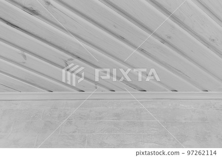 Part of modern interior inside a house with light wood white ceiling and brick wall background Part of modern interior inside a house with light wood white ceiling and brick wall background 97262114