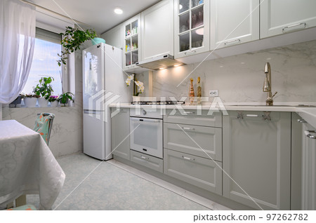 New light grey modern well designed kitchen interior New light grey modern well designed kitchen interior 97262782