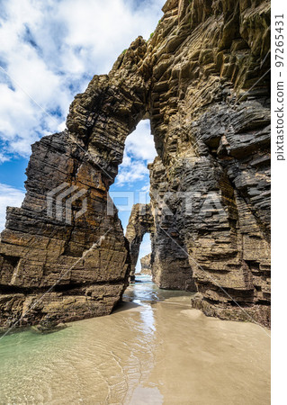 Natural rock arches Cathedrals beach, Playa de las catedrales at Ribadeo, Galicia, Spain Natural rock arches Cathedrals beach, Playa de las catedrales at Ribadeo, Galicia, Spain 97265431