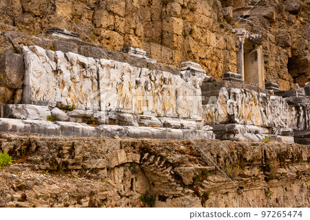 Remains of ornamental reliefs decorating skene of Roman theater in Perge, Turkey 97265474