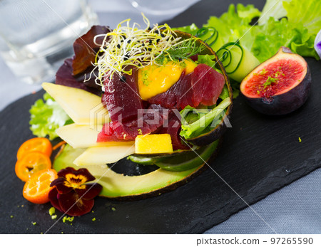 Image of delicious salad of raw tuna, mango, avocado and herbs 97265590