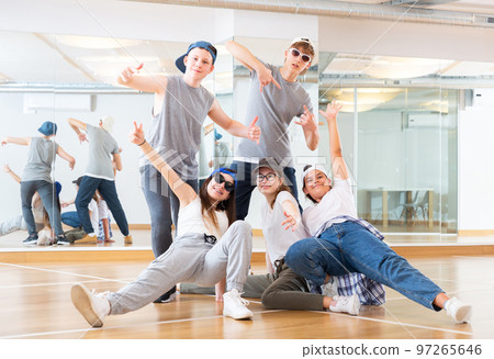 Teens hip hop dancers posing in studio 97265646