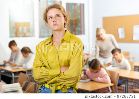 Portrait of thoughtful teenager girl in school 97265751