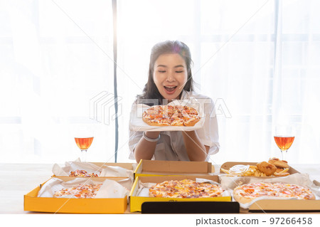 Portrait of Asian celebrate Christmas with champagne and eating pizza at home. Joy of holiday party with friends or colleague concept 97266458