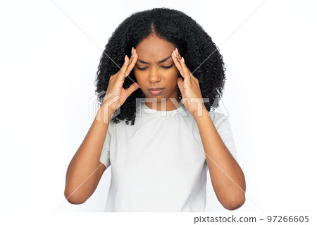 Upset multiracial woman rubbing temples Upset multiracial woman rubbing temples 97266605