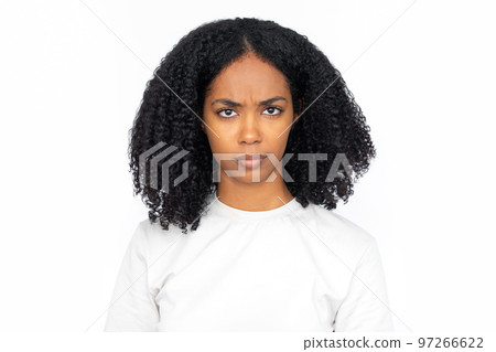 Displeased multiracial woman frowning Displeased multiracial woman frowning 97266622