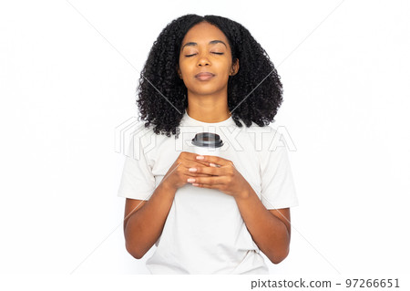 Pleased multiracial woman with cup of coffee Pleased multiracial woman with cup of coffee 97266651