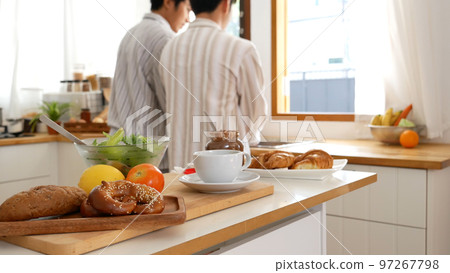Asian people happy time smile, laugh in kitchen. Best friend LGBTQ lifestyle. Happy Asian gay couple homosexual cooking together in kitchen prepare fresh vegetable make organic salad healthy food. Asian people happy time smile, laugh in kitchen. Best friend LGBTQ lifestyle. Happy Asian gay couple homosexual cooking together in kitchen prepare fresh vegetable make organic salad healthy food. 97267798