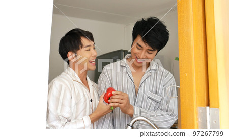 Asian two Man hands wash cleaning fresh vegetable in kitchen. Happy Asian gay couple homosexual cooking together in kitchen wash vegetable organic salad healthy home cook. LGBTQIA lifestyle concept Asian two Man hands wash cleaning fresh vegetable in kitchen. Happy Asian gay couple homosexual cooking together in kitchen wash vegetable organic salad healthy home cook. LGBTQIA lifestyle concept 97267799