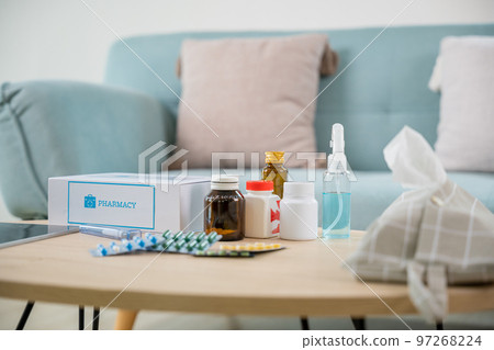 Home medicine with medicine package box free first aid kit with pills from pharmacy hospital delivery service at home on table in living room, online purchase delivery of medicines to your home 97268224