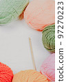 Knitting. Knitting warm clothes on your own. Tangles of wool and knitted things 97270223