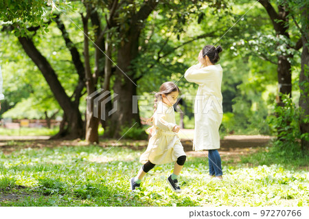 Families playing in the park 97270766