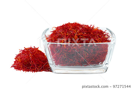 Dried saffron spices in a clear glass bowl isolated on white background. Dried saffron spices in a clear glass bowl isolated on white background. 97271544
