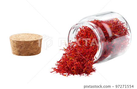 Dried saffron spices spill out of a glass storage jar isolated on white background. Dried saffron spices spill out of a glass storage jar isolated on white background. 97271554