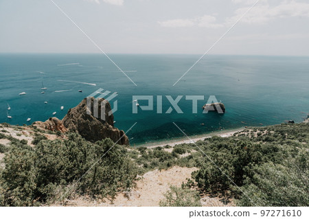 Sea lagoon. Panoramic view on calm azure sea and volcanic rocky Sea lagoon. Panoramic view on calm azure sea and volcanic rocky 97271610