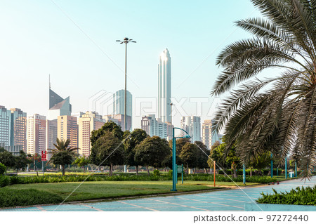 Abu Dhabi Skyline from Corniche. Abu Dhabi, Modern Skyscrapers and Landmark. Promenade in Abu Dhabi. United Arab Emirates, Middle East. Abu Dhabi Skyline from Corniche. Abu Dhabi, Modern Skyscrapers and Landmark. Promenade in Abu Dhabi. United Arab Emirates, Middle East. 97272440