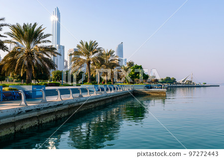 Abu Dhabi Skyline from Corniche. Abu Dhabi, Modern Skyscrapers and Landmark. Promenade in Abu Dhabi. United Arab Emirates, Middle East. Abu Dhabi Skyline from Corniche. Abu Dhabi, Modern Skyscrapers and Landmark. Promenade in Abu Dhabi. United Arab Emirates, Middle East. 97272443