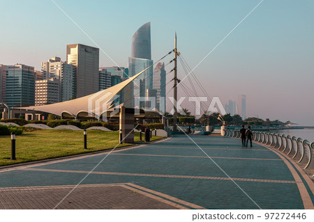 Abu Dhabi Skyline from Corniche. Abu Dhabi, Modern Skyscrapers and Landmark. Promenade in Abu Dhabi. United Arab Emirates, Middle East.  97272446