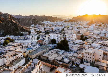 Mutrah Sunset. Cityscape View of Muscat at Beautiful Sunset. The Capital of Oman. Arabian Peninsula. 97273721